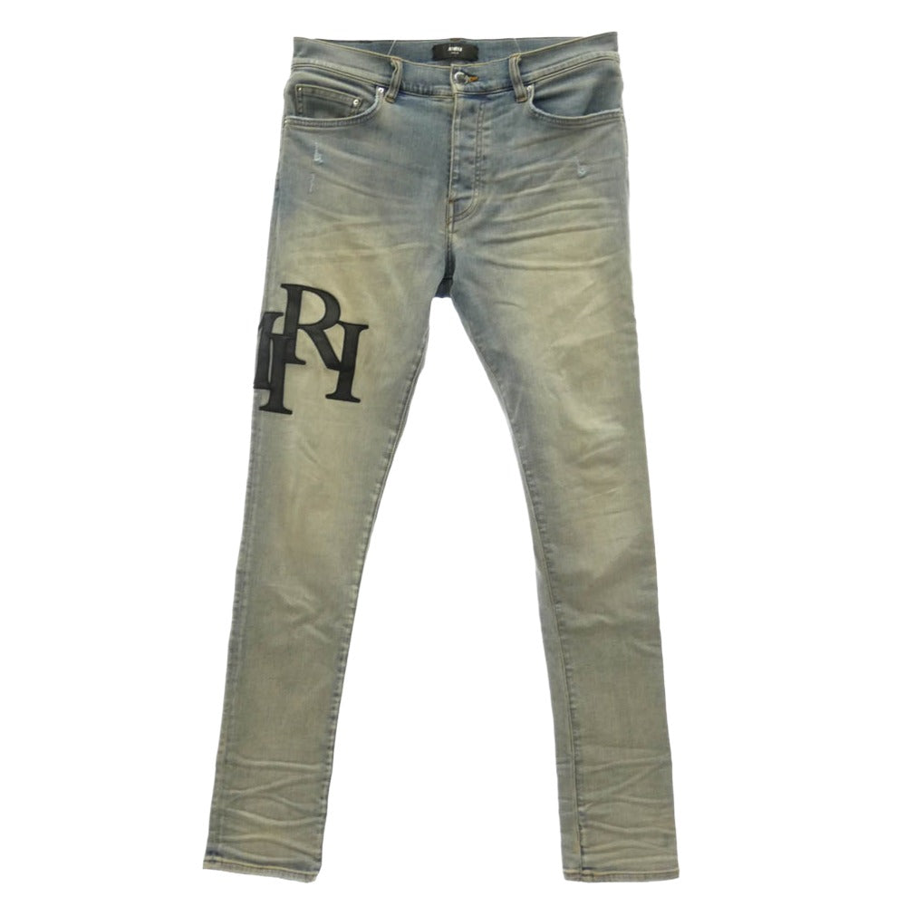 AMIRI アミリ 26SS AMDNSY1114 Staggered Logo Skinny Jean レザーロゴパッチ ダメージ加工 スキニー デニムパンツ ライトブルー系 UK 33【中古】 AMIRI アミリ 26SS AMDNSY1114 Staggered Logo Skinny Jean レザー