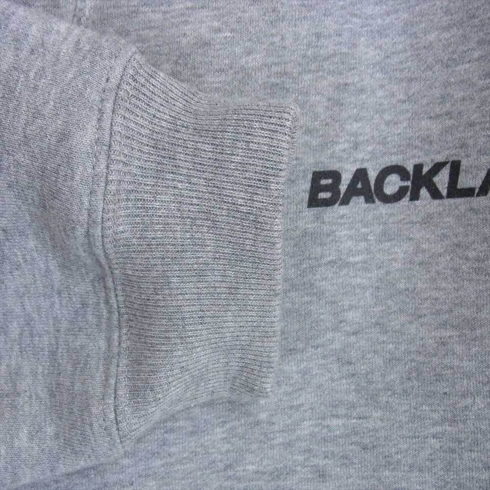 ISAMUKATAYAMA BACKLASH イサムカタヤマバックラッシュ ANONYMOUS アノニマス別注 ロゴプリント プルオーバー フーディ パーカー グレー系 L【美品】【中古】