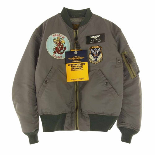 TOY'S McCOY トイズマッコイ TMJ2330 TYPE MA-1 ALBERT TURNER アルバートターナー MIL-J-8279A 405th BS 38th BG DRAGON FLIGHT ドラゴンフライト ブルゾン フライトジャケット モスグリーン系 M【新古品】【未使用】【中古】