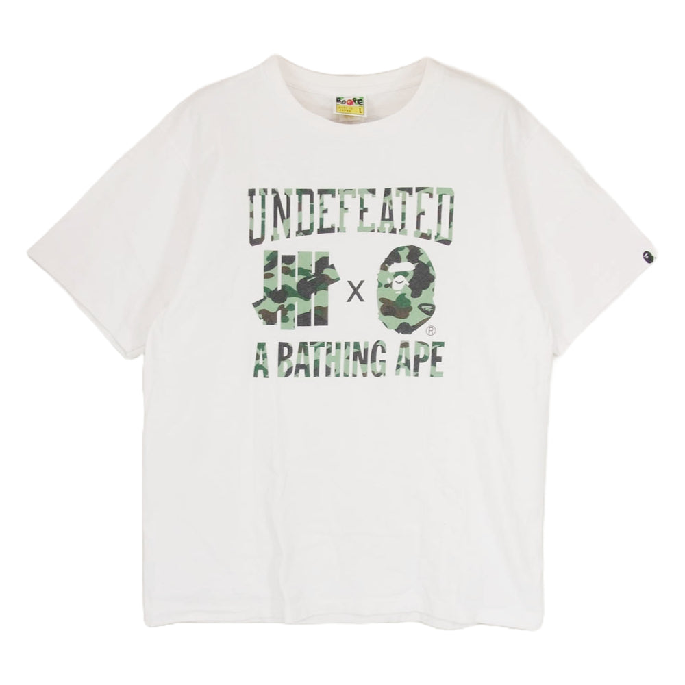 A BATHING APE アベイシングエイプ UNDEFEATED アンディーフィーテッド カモフラ ロゴプリント 半袖 Tシャツ ホワイト系 L【中古】