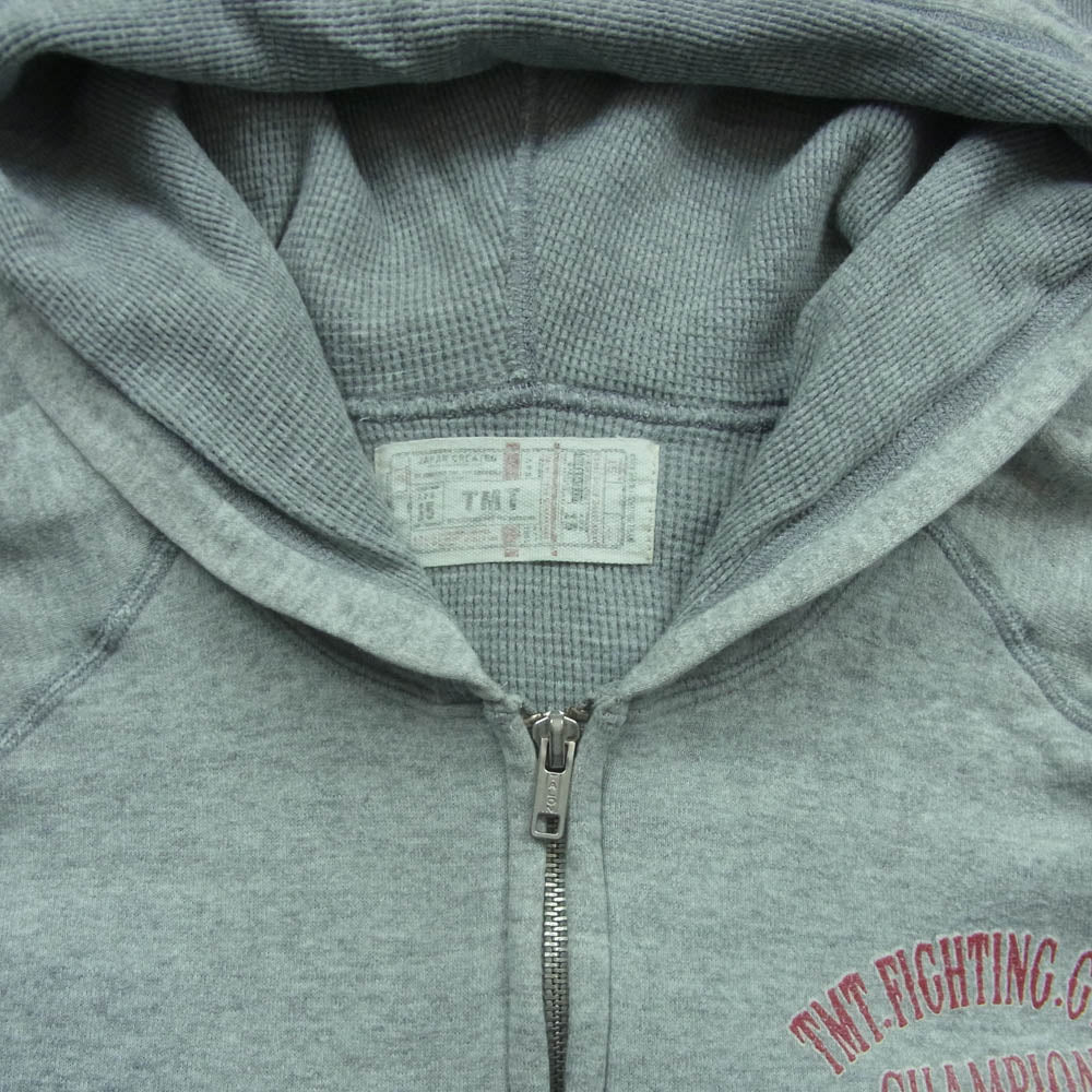TMT ティーエムティー CHAMPION SHIP FIGHTING CLUB バック ロゴ ジップ パーカー コットン 日本製 グレー系 M【中古】