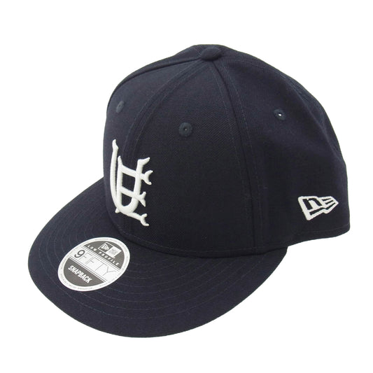 uniform experiment ユニフォームエクスペリメント 23SS UE-230054 × NEW ERA 9FIFTY LOW PROFILE CAP NAVY ニューエラ フィフティー イニシャルロゴ 刺繍 キャップ ネイビー系 ダークネイビー系【中古】
