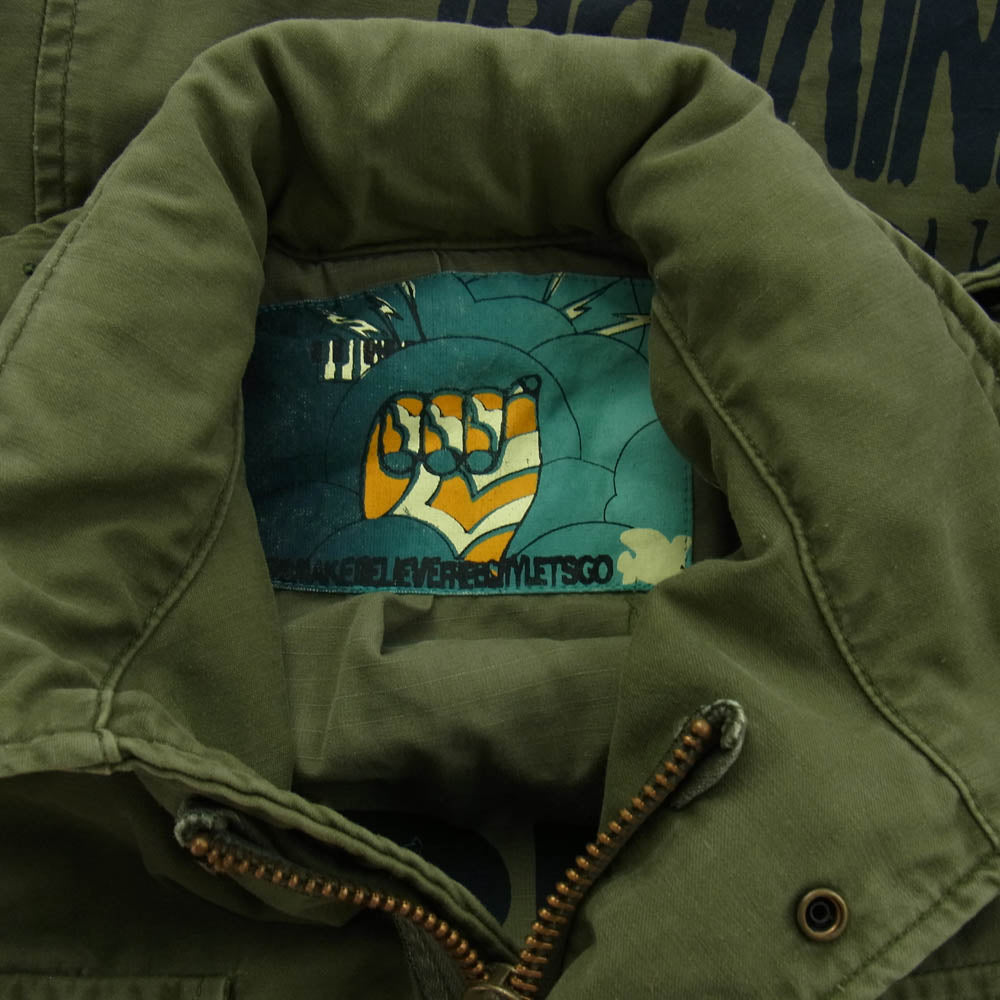 フリーシティ M-65 バックプリント ミリタリージャケット カーキ系 S/M