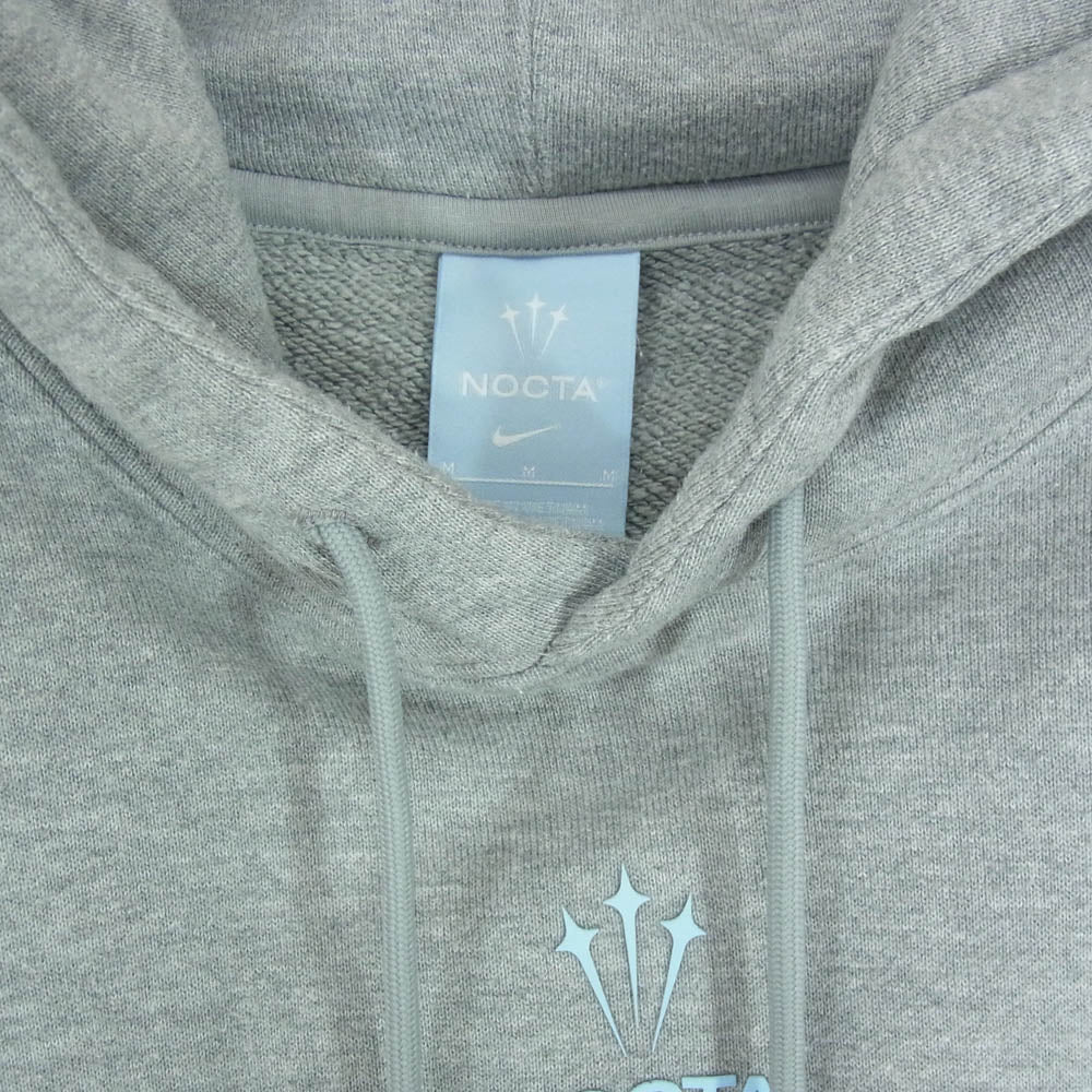 NIKE ナイキ 22AW DX2837-063 × DRAKE NOCTA ドレイク ノクタ NRG DY FLC HOODIE シリコン プリント プルオーバー スウェットパーカー グレー系 M【中古】