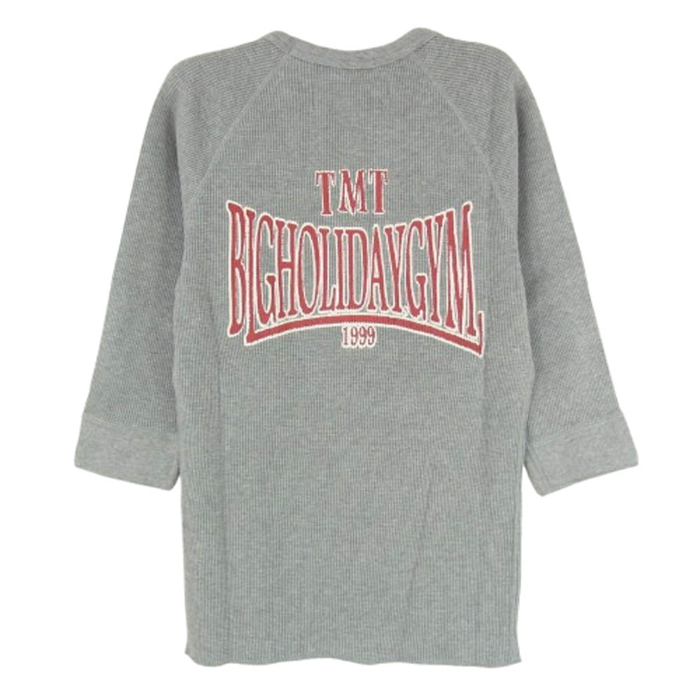 TMT ティーエムティー TCS-S1101 BIGHOLIDAYGYM ロゴ バックプリント コットン 七分袖 Tシャツ グレー系 M【新古品】【未使用】【中古】