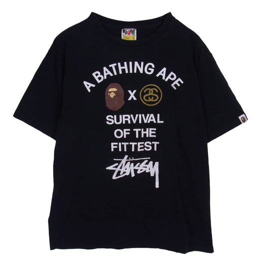 A BATHING APE アベイシングエイプ × STUSSY ステューシー SURVIVAL OF THE FITTED Ｔシャツ ブラック系 L【中古】