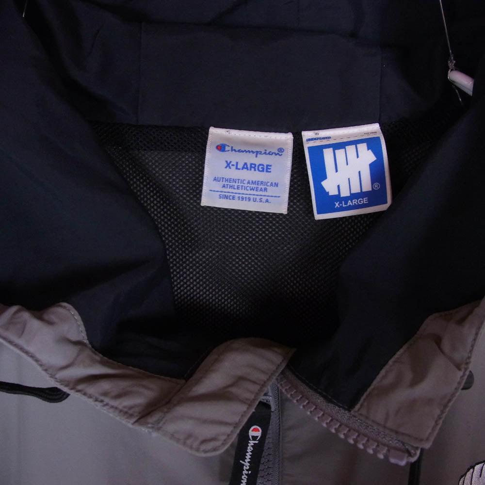 UNDEFEATED アンディフィーテッド C8-S614 × Champion チャンピオン ICON LOGO ANORAK アイコンロゴ刺繍 アノラック ナイロン パーカー ジャケット グレー系 XL【中古】