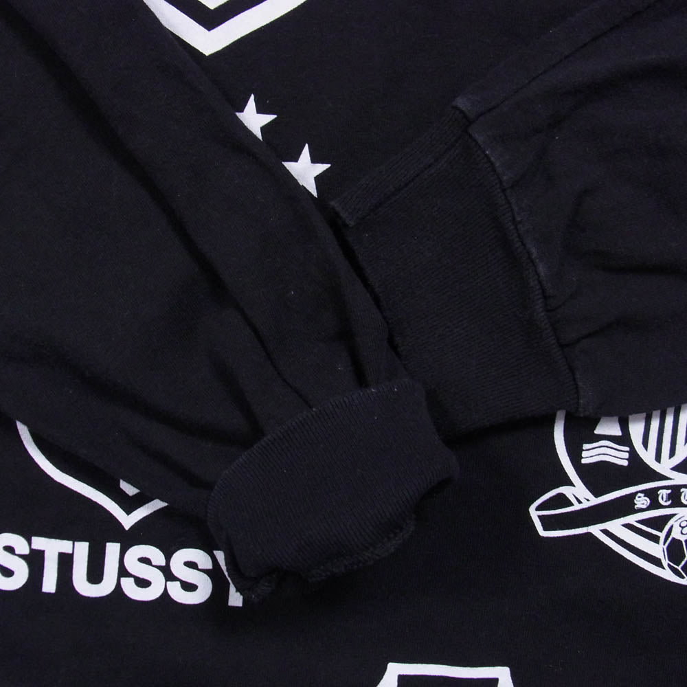 STUSSY ステューシー 【フェイクバスターズ鑑定済】2010 サッカーW杯記念 エンブレム ロングスリーブ 長袖 Tシャツ カットソー ブラック系 M【中古】