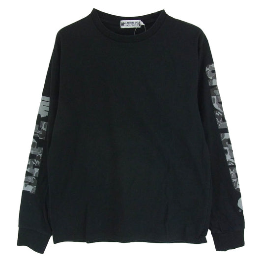 A BATHING APE アベイシングエイプ 001LTG731902X × UNDEFEATED アンディフィーテッド アームマルチ カモ ロゴプリント 長袖 カットソー ブラック系 M【中古】