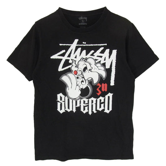 STUSSY ステューシー 30周年記念 × Super Co スーパーコー キャラクタープリント Tシャツ 半袖 カットソー ブラック系 S【中古】