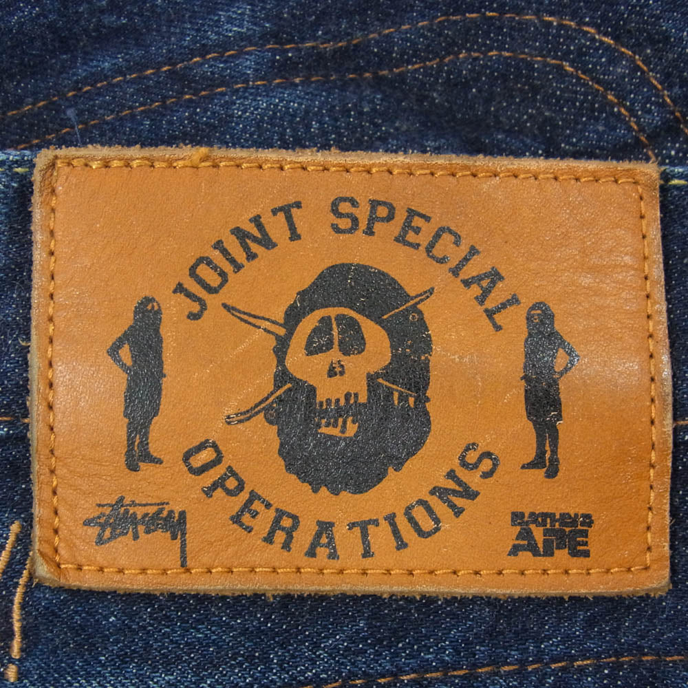 A BATHING APE アベイシングエイプ STUSSY ステューシー × stussy 30周年記念 モデル APE FACE SSリンク 刺繍 デニム パンツ インディゴブルー系 S【中古】