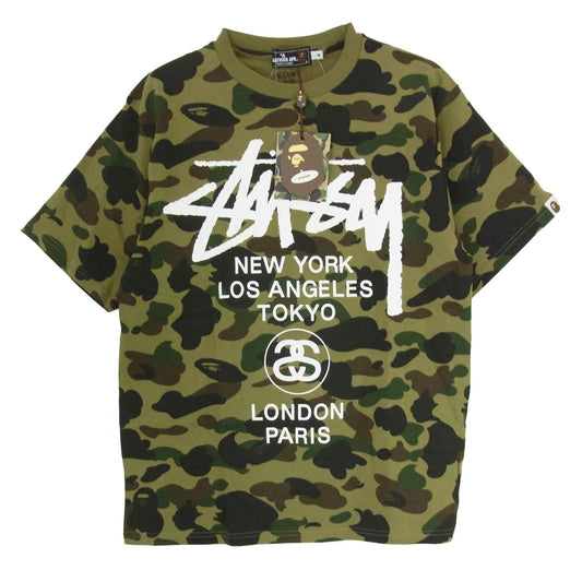 A BATHING APE アベイシングエイプ × STUSSY ステューシー 30周年記念 ワールドツアー ロゴ カモ柄 半袖 カットソー Tシャツ カーキ系 M【新古品】【未使用】【中古】
