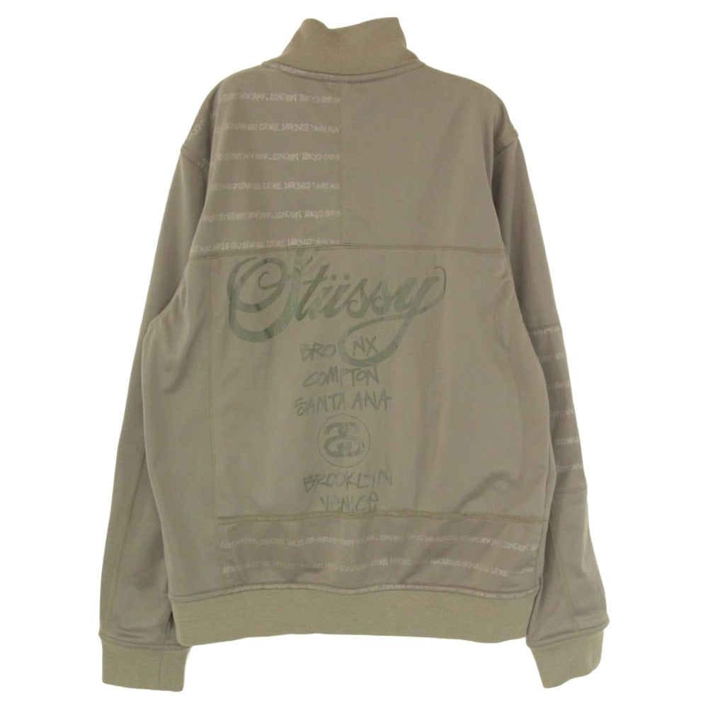 STUSSY ステューシー AUTHENTIC GEAR Track Jacket world tour london tokyo ワールドツアー パネル 切替 トラック ジャケット カーキ系 M【中古】