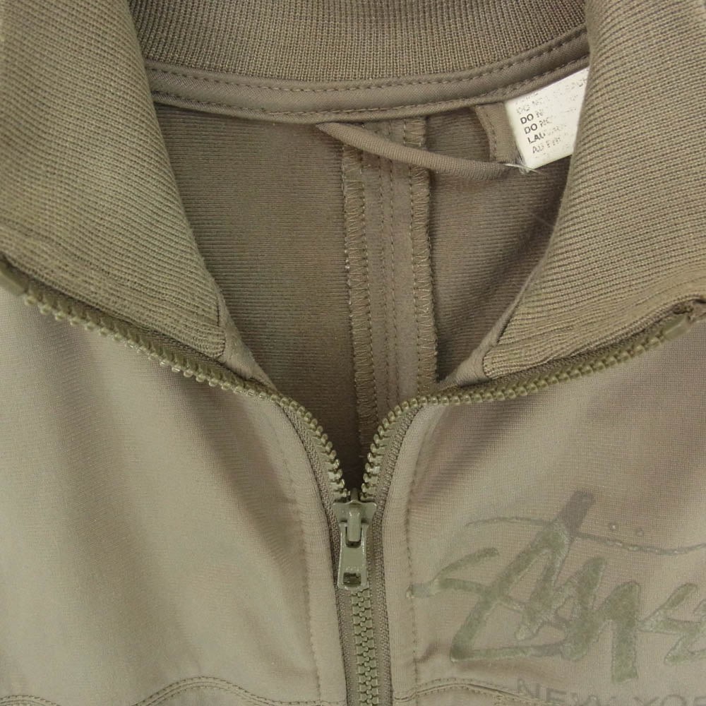 STUSSY ステューシー AUTHENTIC GEAR Track Jacket world tour london tokyo ワールドツアー パネル 切替 トラック ジャケット カーキ系 M【中古】