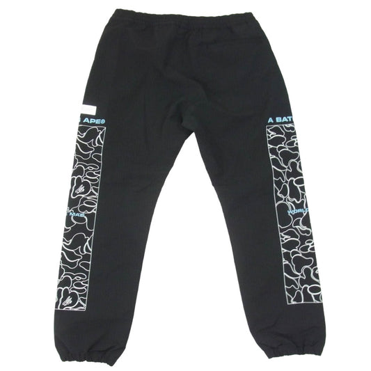 A BATHING APE アベイシングエイプ 001PTH801011M Rip Stop Track Pants サイドプリント リップストック トラックパンツ ブラック系 L【中古】