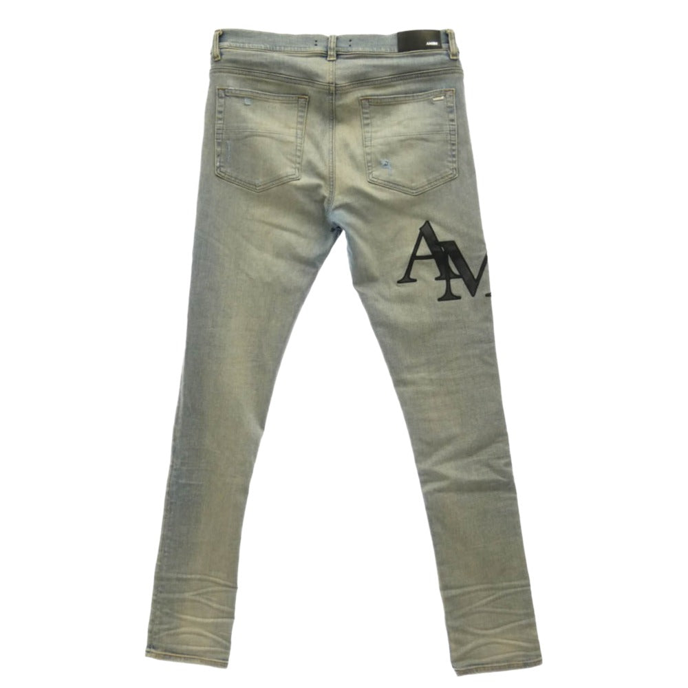 AMIRI アミリ 26SS AMDNSY1114 Staggered Logo Skinny Jean レザーロゴパッチ ダメージ加工 スキニー デニムパンツ ライトブルー系 UK 33【中古】
