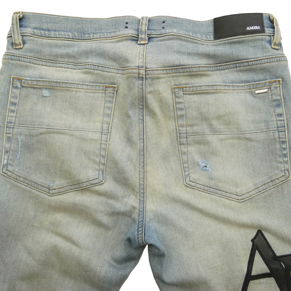 AMIRI アミリ 26SS AMDNSY1114 Staggered Logo Skinny Jean レザーロゴパッチ ダメージ加工 スキニー デニムパンツ ライトブルー系 UK 33【中古】