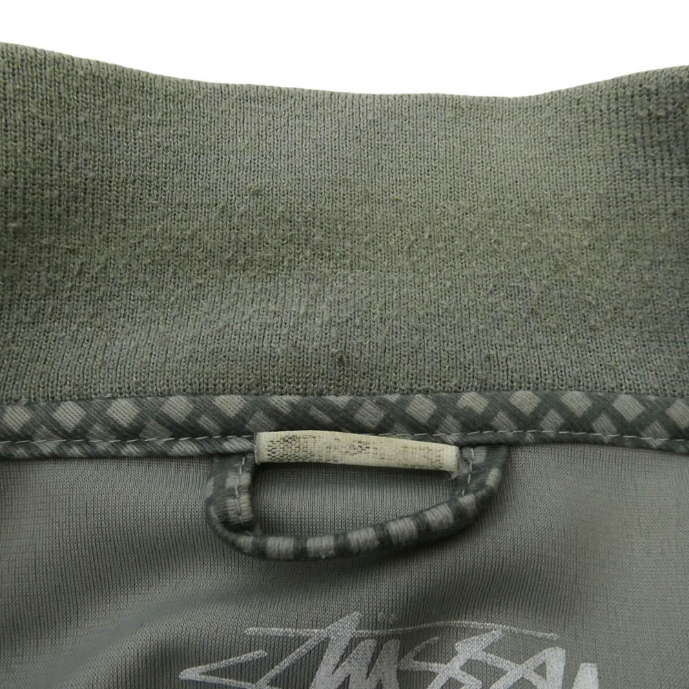 STUSSY ステューシー AUTHENTIC GEAR 総柄 ロゴ プリント ジップアップ トラックジャケット ジャージ モスグリーン系 カーキ系 M【中古】