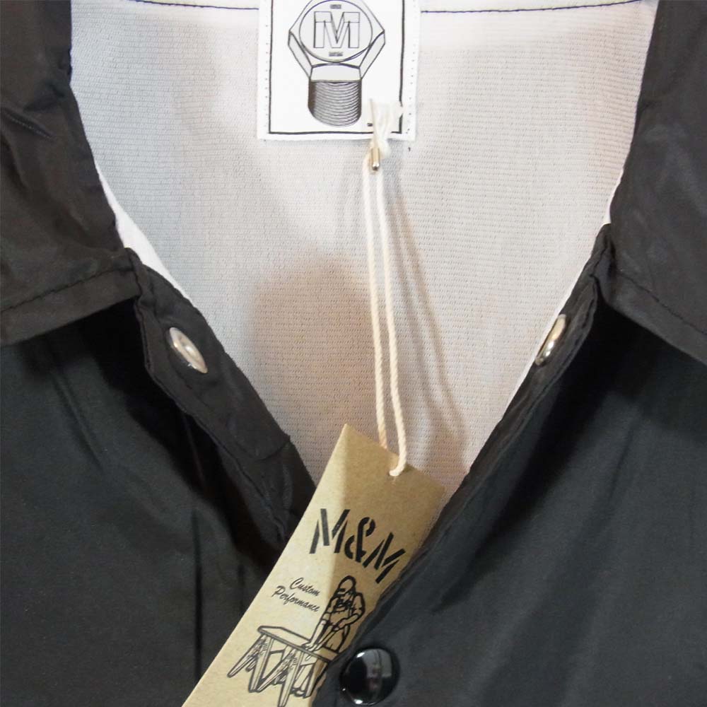 エムアンドエムカスタムパフォーマンス PRINT WINDBREAKER プリント ウィンドブレーカー コーチジャケット ブラック系 M【新古品】【未使用】【中古】