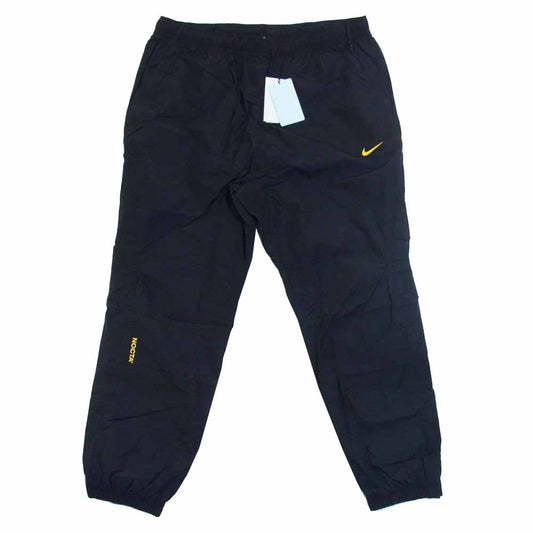 NIKE ナイキ DB2816-010 x DRAKE NOCTA M NRG AU TRACK PANT ESS ドレイク ノクタ トラック パンツ ブラック系 XL【新古品】【未使用】【中古】