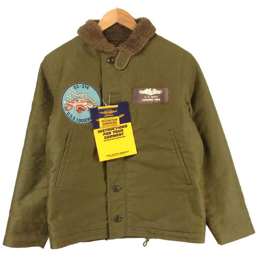 TOY'S McCOY トイズマッコイ TMJ1431 N-1 FELIX SS-374 ロガーヘッド フィリックス ワッペン バックプリント デッキ ジャケット カーキ系 34【新古品】【未使用】【中古】