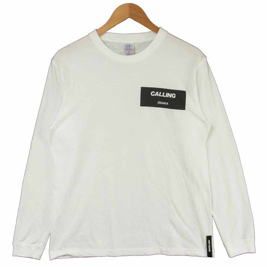 イサムカタヤマ バックラッシュ CALLING OSAKA ロンT 長袖 Tシャツ ホワイト系 M【中古】