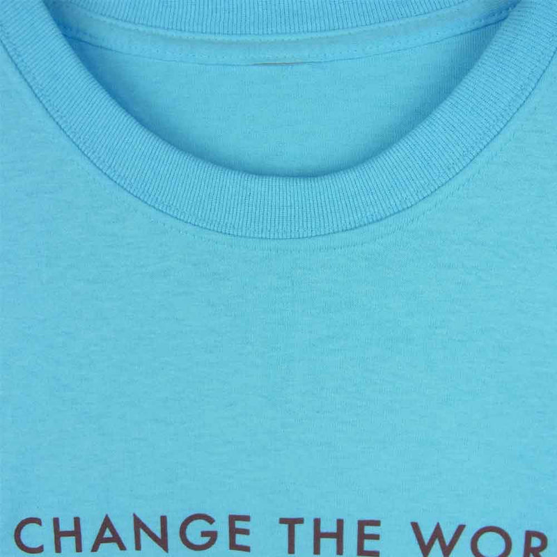 ティーアールサスペンション CHANGE THE WORLD (a little bit) 半袖 Tシャツ ライトブルー系【中古】