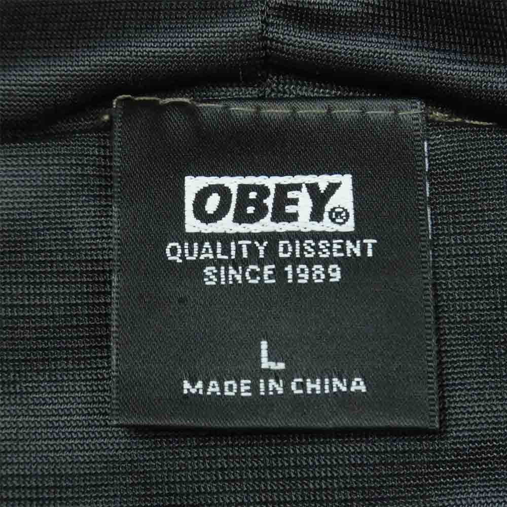 OBEY オベイ カモフラ ロゴ パーカー ナイロン 中国製 カーキ系 L【中古】