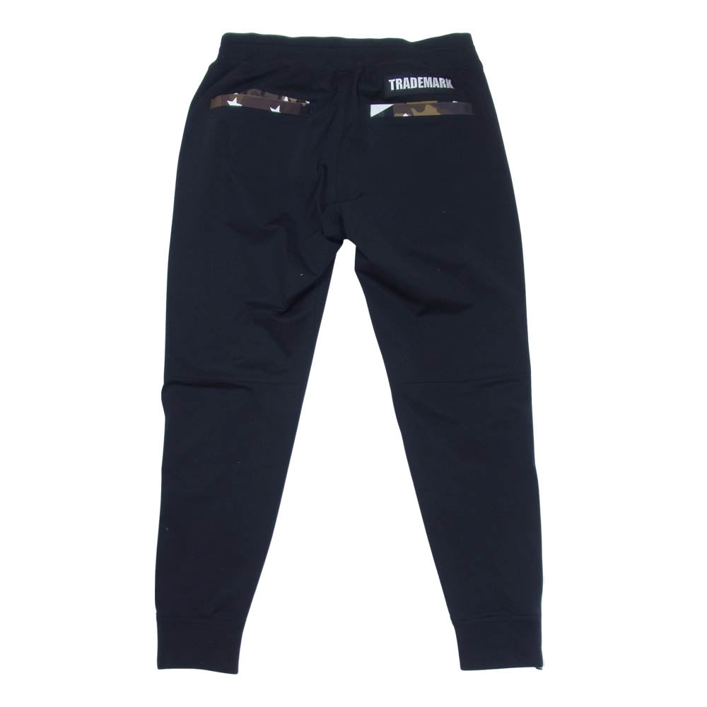 AKM エイケイエム x Brown bunny ブラウンバニー LUXE163 スター カモ プリント 裾ジップ ストレッチ イージー パンツ ブラック系 L【中古】