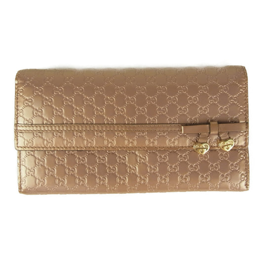 GUCCI グッチ 258405 0416 シャイニー マイクロ グッチ シマ リボン チャーム フラップ ウォレット 長財布  ピンク系【中古】