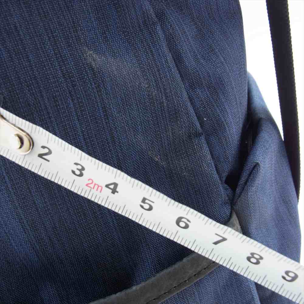 ディーケリー ロゴプレート デイパック リュックサック ネイビー系【中古】
