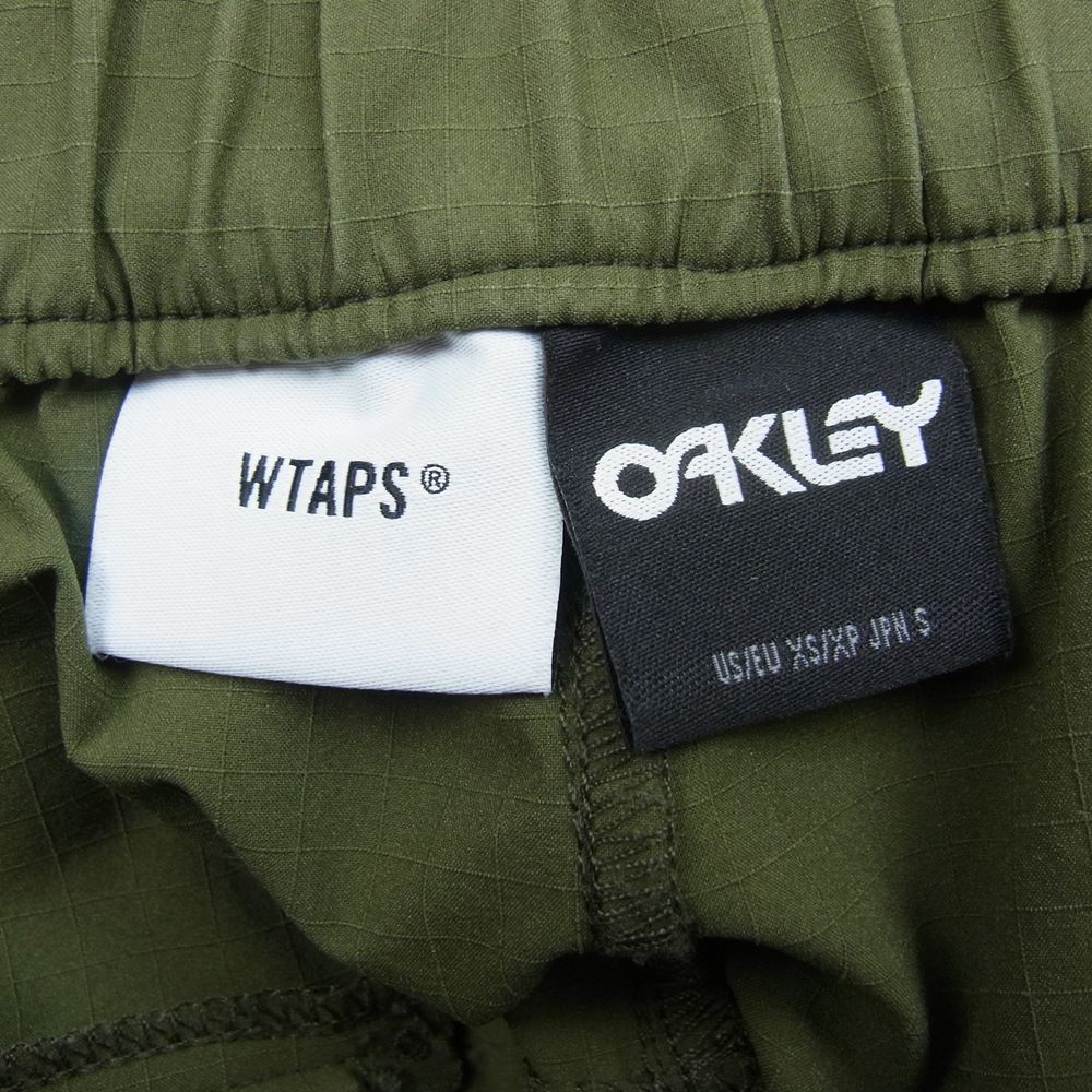 WTAPS ダブルタップス 19SS 1910JOKD-PTM01 × OAKLEY KEYS TROUSERS. POLY. RIPSTOP オークリー リップストップ トラウザー パンツ カーキ系 S【美品】【中古】