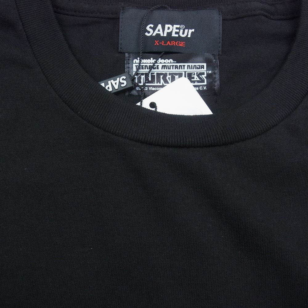 サプール 22SS A0022-141 TURTLES タートルズ プリント ロゴ 半袖 Tシャツ ブラック系 XL【新古品】【未使用】【中古】