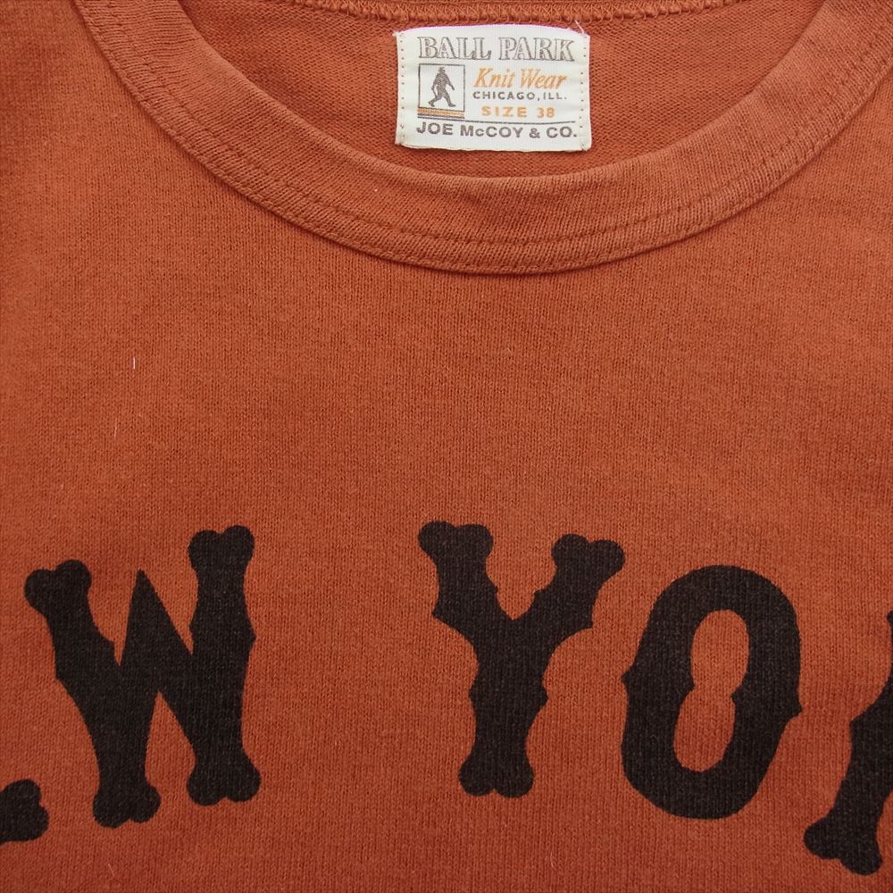 The REAL McCOY'S ザリアルマッコイズ JOE McCOY & CO. ジョーマッコイ BALL PARK ボールパーク NEW YORK プリント ラグラン カットソー オレンジ系 38【中古】